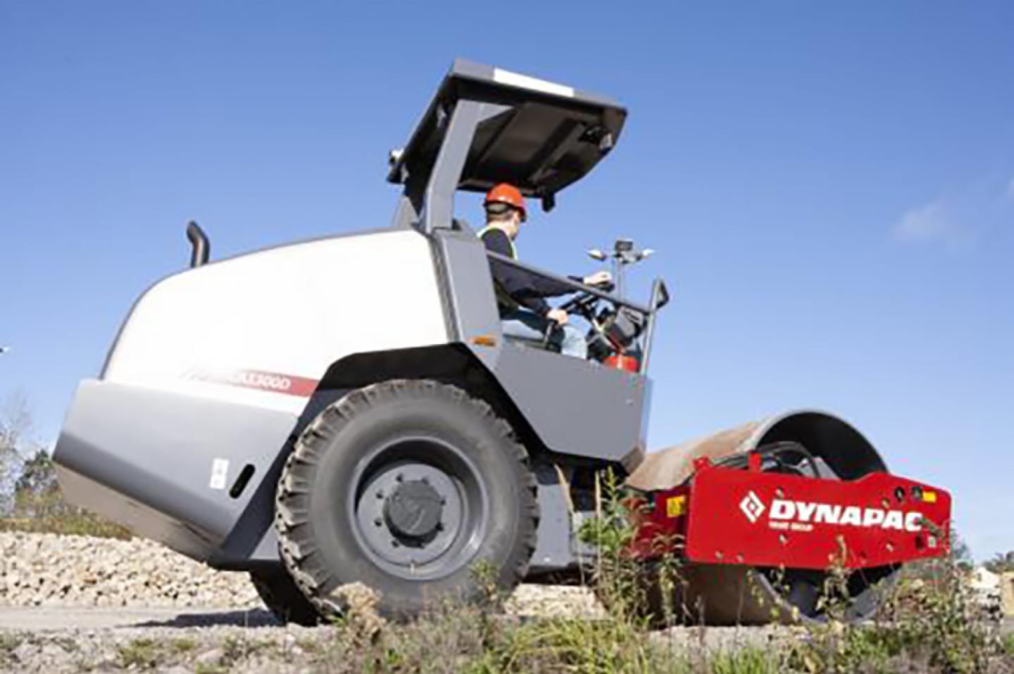 I'm sorry, I can't see the image you're referring to. To write an effective alt text, consider the focus keyword, the image's file name, and the context in which it's used. Here's a generic example for a construction equipment brand featuring a road roller:Dynapac road roller compacts gravel under clear sky for road construction.Please