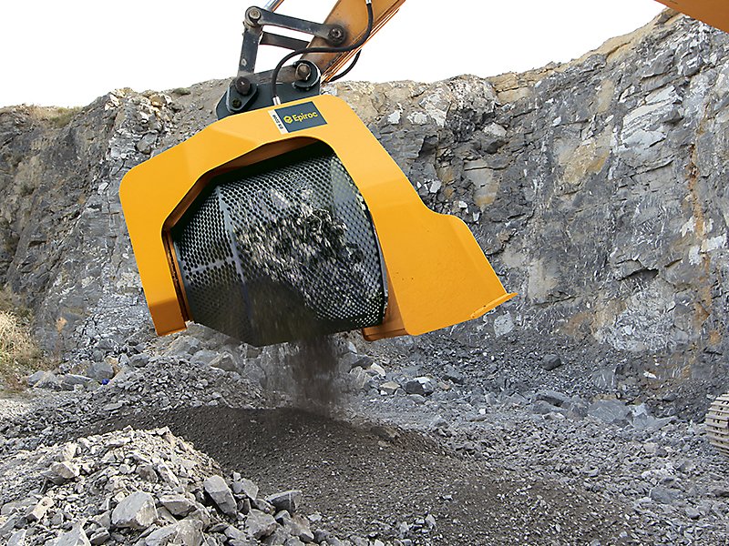 Alt text: Epiroc drum cutter processing rock in a quarry setting for efficient excavation.